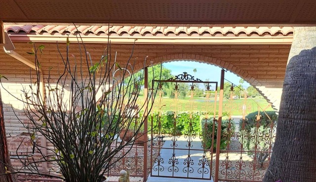 Golf course view home with a private backyard oasis