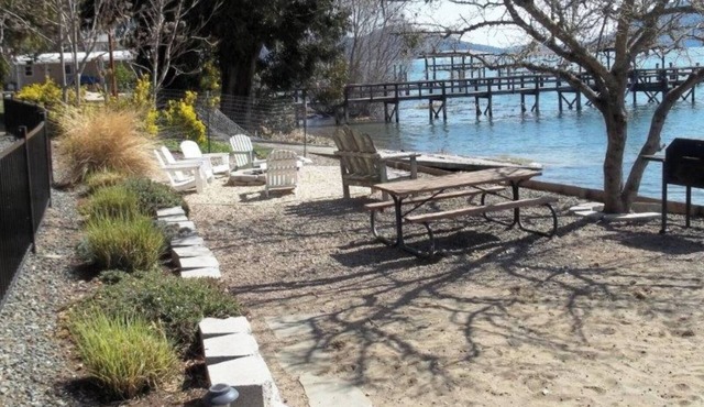 Great Price! Sunset Beach Cottage with Lovely garden, beach, and boat dock!