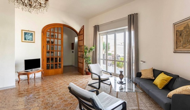 GuestHost - Comfortable 100 sqm apartment, perfect for a stay of four people, located on the mezzanine floor of a building (accessible by steps).The property is located in Surbo, in the province of Lecce, in an area equipped with every comfort and servic