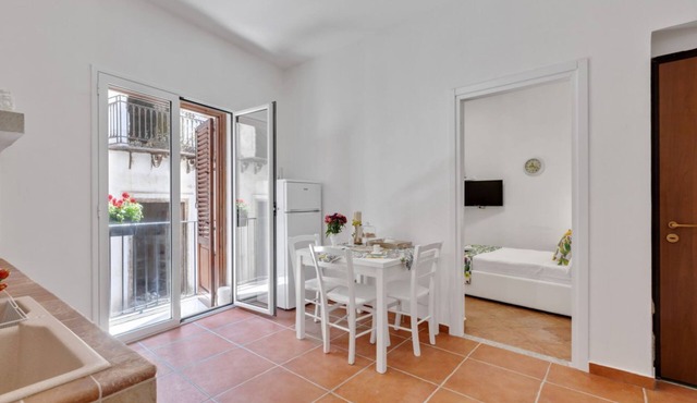 GuestHost - Cozy 60 sqm apartment, for 3 people, with 3 balconies and located on the 2nd floor of a renovated building without lift. The property is located in the heart of the historic center (Traffic Restricted Area), inside Vucciria area, one of the c