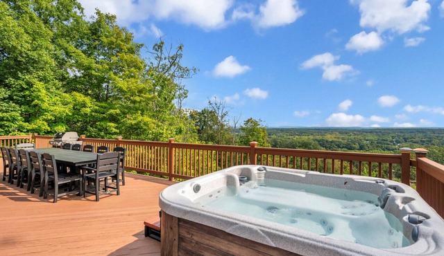 Hilltop A-frame chalet, skyline views, heated pool and hot tub, expansive.