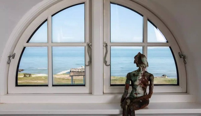 Historical beachhouse with fireplace and view of Sweden