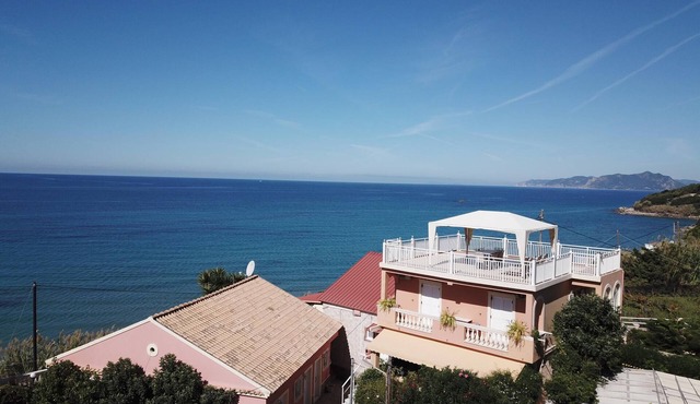 Holiday apartment directly at the sea, large terrace, 5 persons | Paramonas, Kor