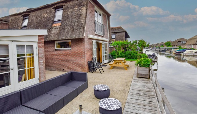 Holiday home with waterside terrace