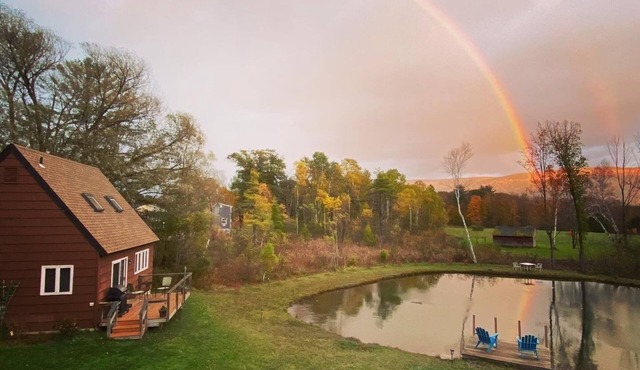 Home with a spring-fed pond and mountain view.