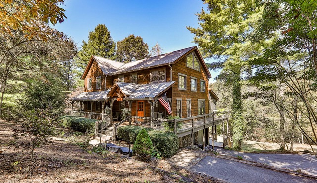 Homey riverfront cabin with hot tub, grill, wood fireplace, AC, & scenic views