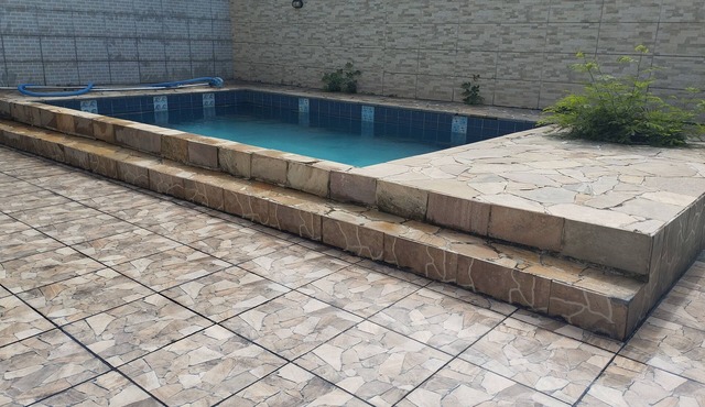 House with pool and barbecue in front of Praia da Brisa