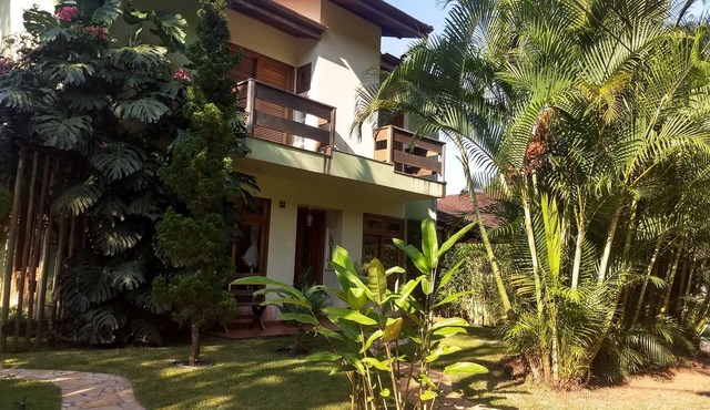 House in a gated community, surrounded by lush nature and rivers for swimming.