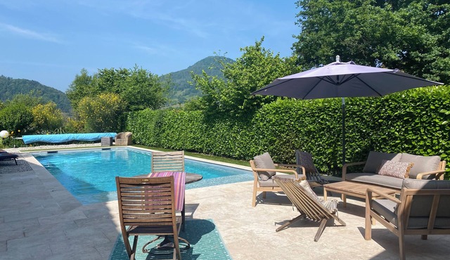 House with beautiful swimming pool and wooded garden inviting you to laze around