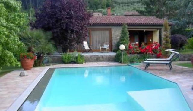 House with large veranda, garden and swimming pool