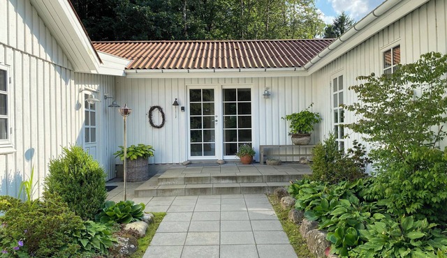 Idyllically situated wooden house by the forest