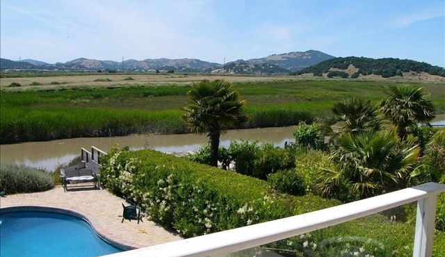 Incredible Waterfront Property, Pool, Boat, Gardens, and More!