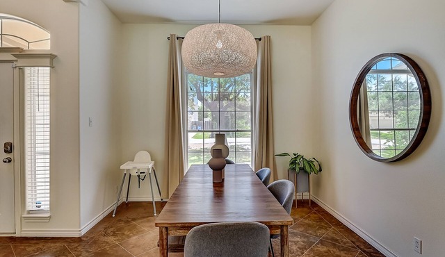 Inviting home with a full kitchen, fireplace, deck & fenced yard