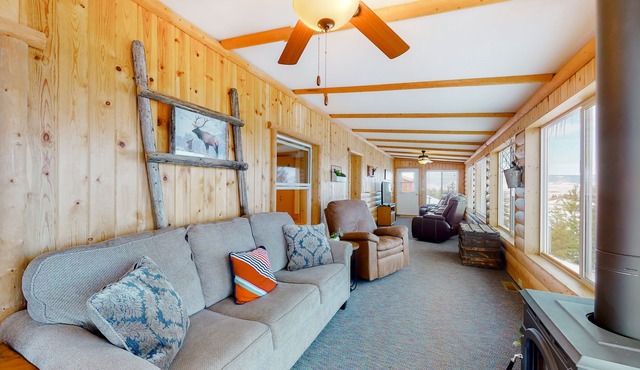 Inviting lake view home with fireplace, golf nearby, full kitchen, & W/D