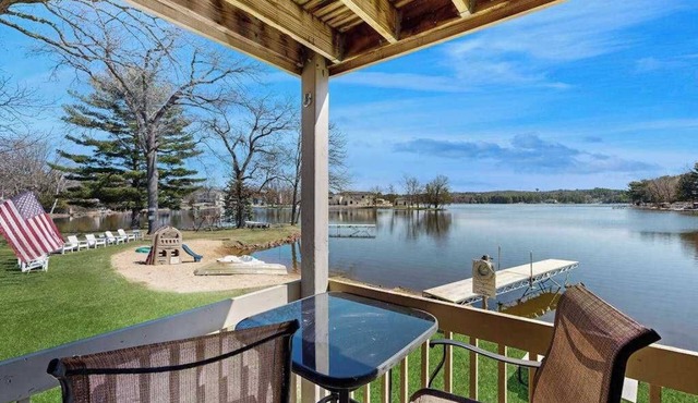 Inviting lakefront condo - amazing views, beach access, fireplace, dock, AC, W/D