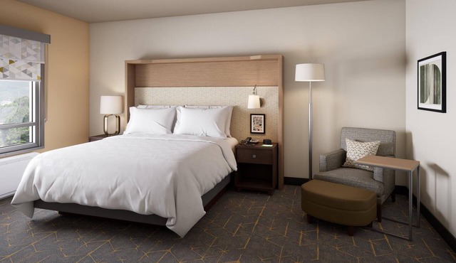 Kick Back After Tanger Mall Shopping in This Inviting Room w/Free Breakfast