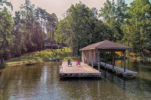 Lakefront home with boat dock, private firepit & game room - dog-friendly