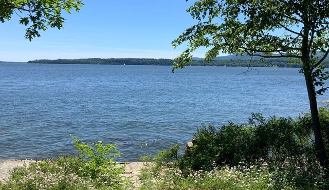 Lakefront home with tennis court and dock on gorgeous Lake Champlain