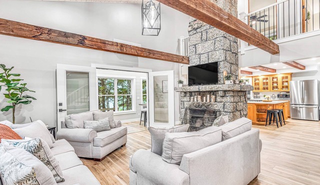 Lakefront, newly rebuilt, dog-friendly home with private beach, dock & firepit
