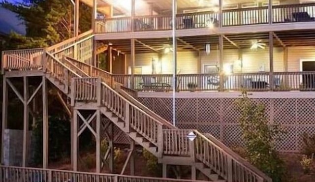 Lakefront sunset mtn view outdoor oasis, with waterslide and diving board.
