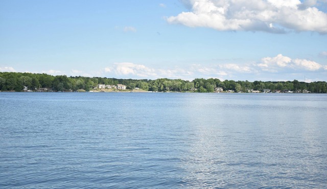 Lakeside living awaits at beautiful Lake Milton, OH with dock across the street