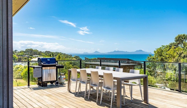 Langs Beach House - Modern, sunny holiday home with large decks and stunning views over Bream Bay