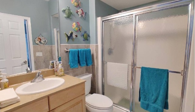 Large custom Home with ocean view, roof top deck, off street parking.