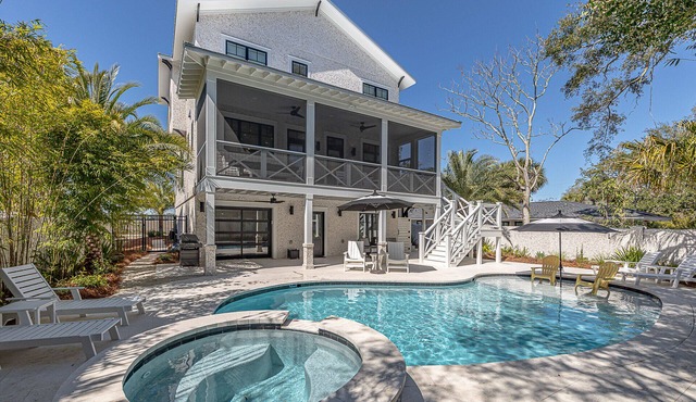 Large marsh front home with private pool and short walk to beach.