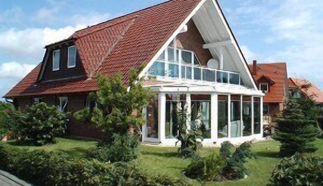 Light and friendly roof apartment with a patio and balcony