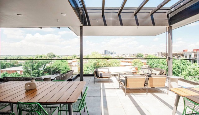 Light filled new 2 BR in the heart of Charlotte's dynamic South End. Steps to the Rail Trail + Light Rail = easy access to Uptown events. Rooftop Lounge w/skyline views, and luxe shared co-working spaces. Perfect for work, play or extended stay.