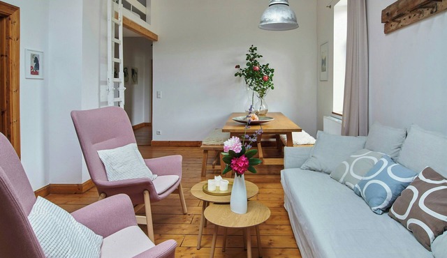 Loft with designer pieces on a former pony farm