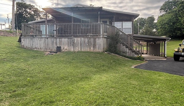 Log Cabin with a waterfront view. Access to boat ramp and swimming dock!