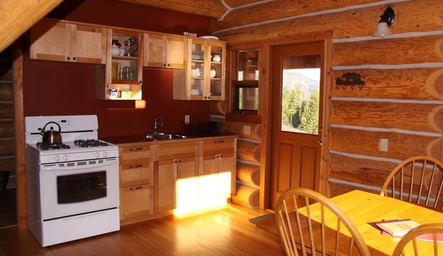 Log Chalet with private lake in the wilderness area