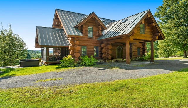 Log manor on 65 private acres of land with entertaining amenities & hot tub