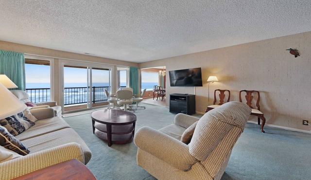 Lovely oceanfront condo with sweeping water views and balcony