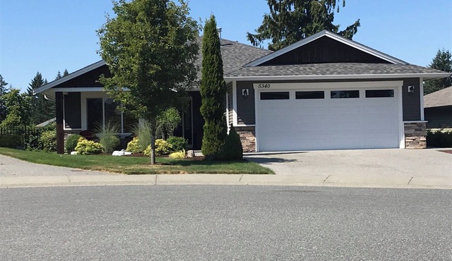 Lower Level Entry Home with private Patio & back yard.