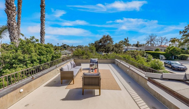 Luxe villa with ocean-view rooftop deck, workstations, sauna, fireplace, grill