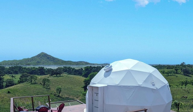 Luxurious Dome set on hillside with views to a lagoon, the ocean and mountains