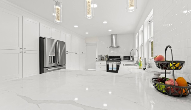 Luxurious & Tranquil Home with Private Backyard