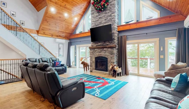 Luxurious waterfront home with deck, firepit, hot tub, fireplace, & pool table