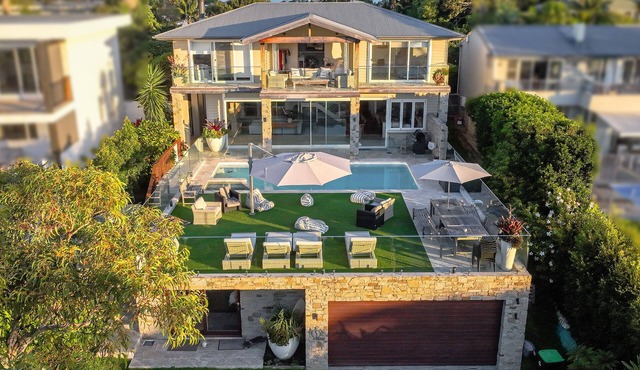 Luxury family resort style Palm Beach home with tennis court, spa and pool