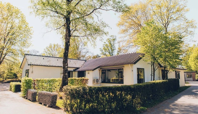 Luxury group accommodation with stylish interior, modern comforts, five bedrooms, spacious kitchen and garden, ideal for a relaxing stay.