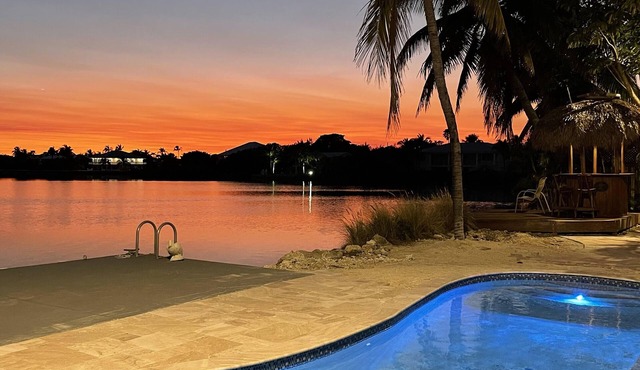 Luxury Waterfront Home with Gorgeous Pool, Tiki Bar and Sunsets