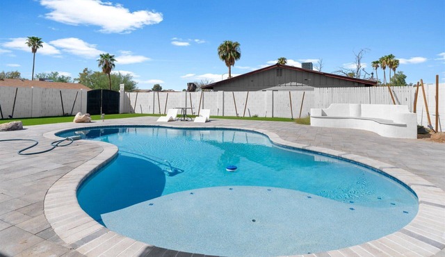 Mesa home with a pool, hot tub, and easy access to golf, dining