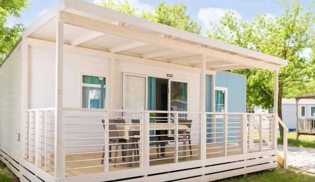 Mobile home with air conditioning and wooden veranda