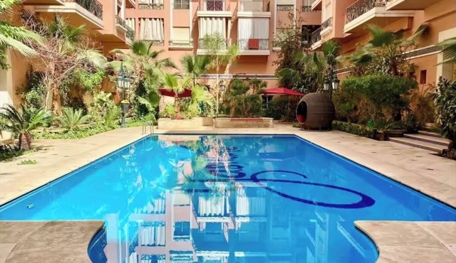 Modern 140 m² duplex - 2 bedrooms with terrace and shared swimming pool. Gueliz.