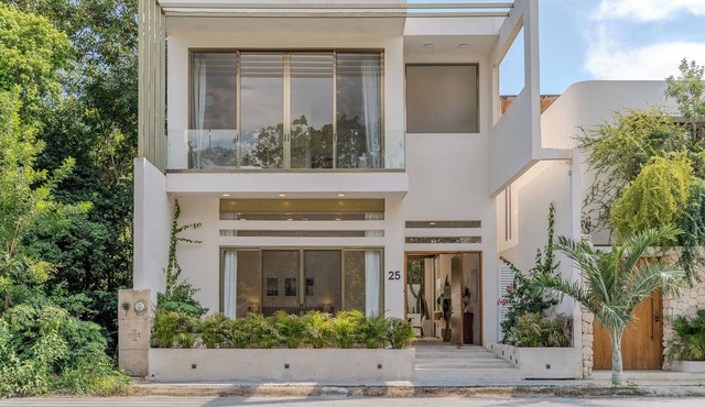 Modern 4-bedroom 4- bathroom villa with private pool in Tulum.