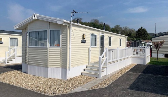 Modern and contemporary 12ft-wide caravan with one double and one twin.