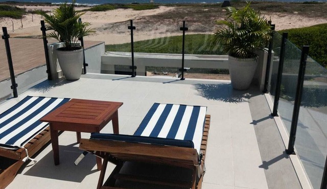 Modern beachfront house with private pool and barbecue.
