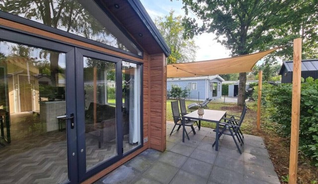 Modern chalet retreat with spacious garden in the Veluwe.